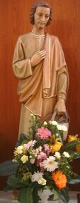 Statue of St Joseph, and flowers