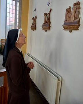 Sister reflecting on the Stations of the Cross