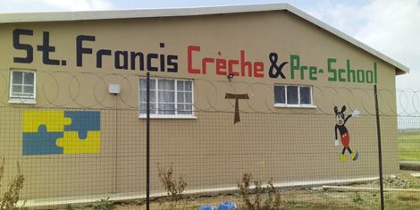 Building with the words St Francis Creceh and PreSchool painted on the sidePicture